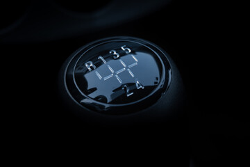 Closeup shot of the manual gear shifter isolated on  dark background