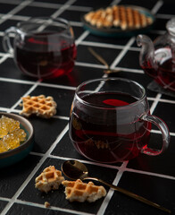 cups of hibiscus tea and cookies