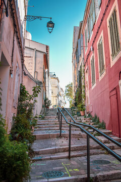 Stairs and pink old buildings in the Le Panier neighborhood of Marseille, France