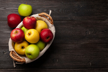 Colorful ripe apple fruits in basket