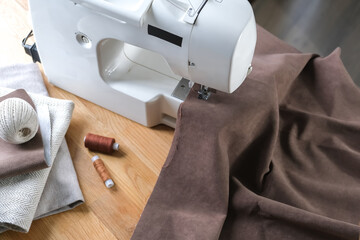 Sewing. Recycling Made by hand from home.sewing machine and the project quarantine, lockdown.Hobby,meditation,zero waste,recycling.Girl sews clothes home on sewing machine, ecology,sewing backround