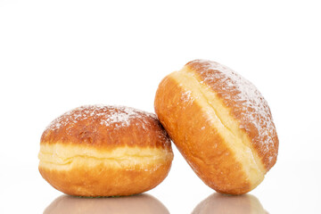 Two sweet donuts stuffed with jam, macro, isolated on a white background.