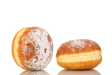 Two sweet donuts stuffed with jam, macro, isolated on a white background.