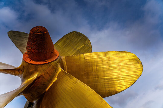 Low angle shot of ship brass fan blades