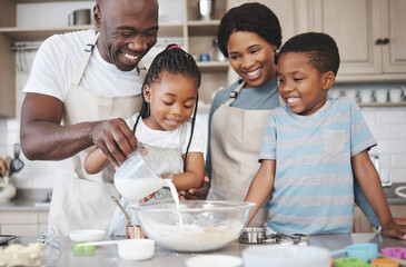 The bond that links your true family is love. Shot of a family baking together in the kitchen.