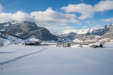 Fototapeta na wymiar A road in Gstaad winter village 