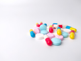 Selective focus of pills and capsules isolated on a white background with copy space