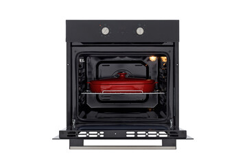 Black oven with open door and red baking dish front view, isolated on white. with two control knobs and switched on backlight