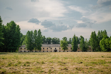 Picturesque urban vintage landscape before a thunderstorm. The ruins of the soldiers' barracks of...