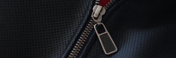 Closeup of steel zipper on leather jacket © H_Ko