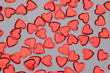 many heart confetti isolated on gray surface