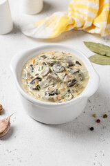 Creamy vegetable mushroom sauce in pot. Top view, copy space.