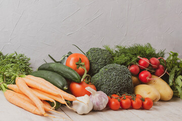 Assortment organic vegetables on wooden table