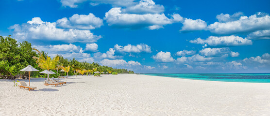 Beautiful panoramic tropical island with beach chairs umbrellas and coconut palm trees on white...