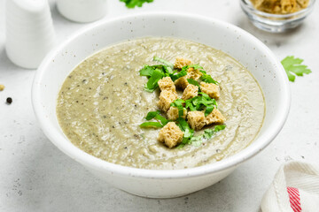 Mushroom soup in a bowl. Copy space, top view.