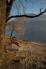 Red bench on the shores of Maggiore lake, Switzerland