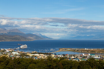 Fototapeta na wymiar Aerial view of Ushuaia city port with boats and cargo ships. End of the world