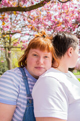 Naklejka premium Portrait of a lesbian couple in the park.