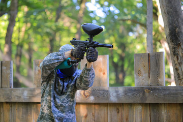 Paintball player in full gear at the shooting range