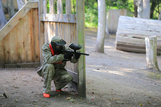 Paintball player in full gear at the shooting range
