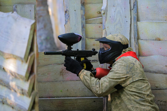 Paintball player in full gear at the shooting range