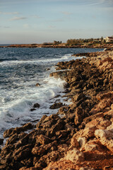 Rocky coastal landscape scene at shore of ocean. High quality photo