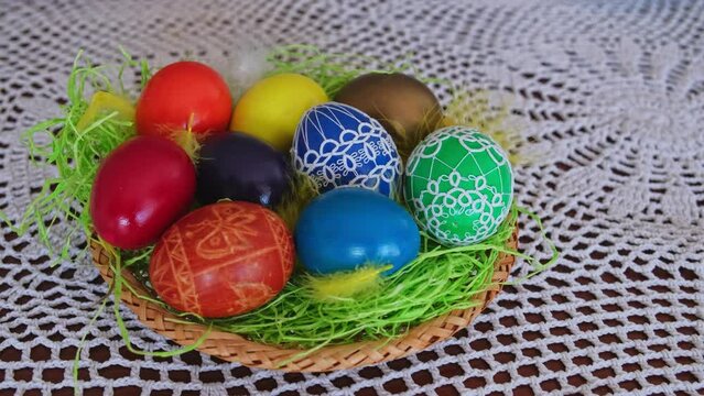 Table Basket With Colorful Painted Eggs Decorated with Handmade Traditional Polish Ornaments for Easter Holidays