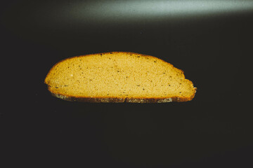 whole grain buckwheat bread on black background, homemade