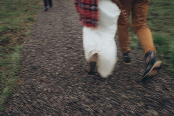 legs of the departing bride and groom in motion and out of focus