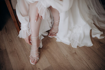 the bride fastens her shoes