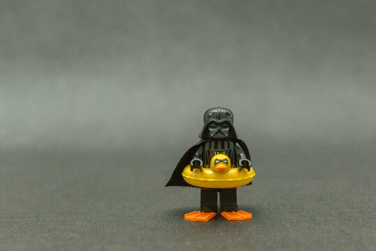 Minifigure of Darth Vader on vacation wearing a duck float and fins