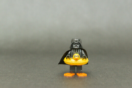 Minifigure of Darth Vader on vacation wearing a duck float and fins