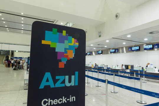 Campinas, Viracopos Airport, Brazil - March 24, 2022: Azul airlines totem for check-in and luggage dispatch. Airport with few people checking in to obtain their boarding pass.