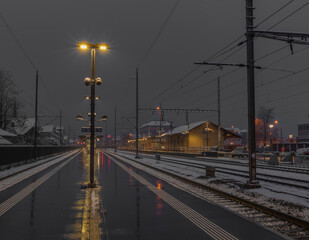 Fototapeta na wymiar Very bad weather in Brunnen station in spring snowy morning