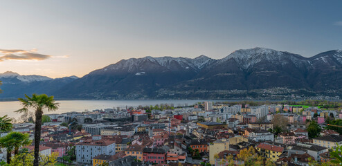 Obraz premium View over Maggiore lake and Locarno town in spring sunny morning
