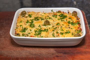 Baked rice with cheese and fresh herbs typical Brazilian. 