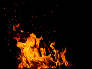 Fototapeta na wymiar Abstract flame of fire from a campfire on a black background