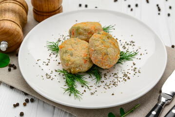Steamed chicken cutlets with vegetables.