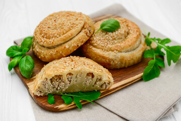 Twist Pie. Greek twist meat pie on white background