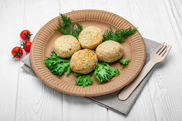 Obraz na płótnie Canvas Fried vegetable cutlets on a paper plate. Healthy food.