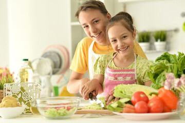 Cute brother and sister cooking