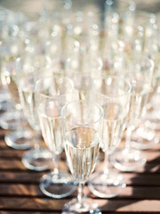 champagne glasses on the table. glasses of champagne. table setting in a restaurant. wedding table setting. glass of wine