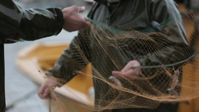 Fishermen at work, pulling the nets stock photo