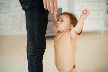 child reaches out to father