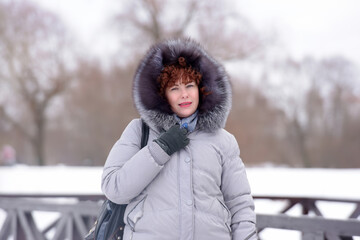 woman in winter in a gray jacket