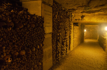 The Catacombs of Paris underground ossuaries, which hold the remains of more than six million people. Details of skulls and bones. France
