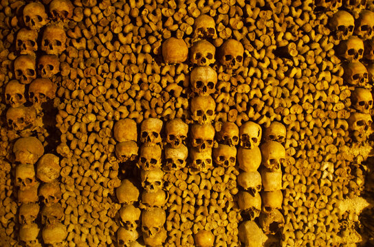 The Catacombs of Paris underground ossuaries, which hold the remains of more than six million people. Details of skulls and bones. France
