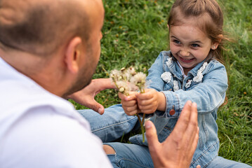 happy, emotional, father playing with daughter in nature. The concept of a happy family, comfort, family time. Selective focus