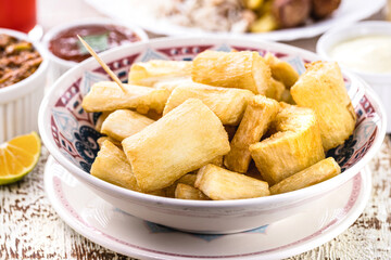 fried sweet cassava, served with vegetables and spices, typical Brazilian food