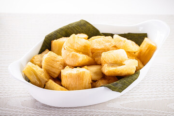 fried cassava with vegetables and sauces, a typical Brazilian snack served in restaurants and bars